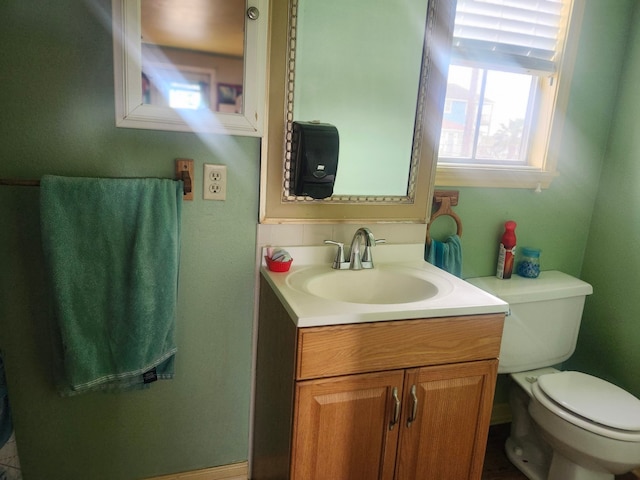 bathroom with vanity and toilet