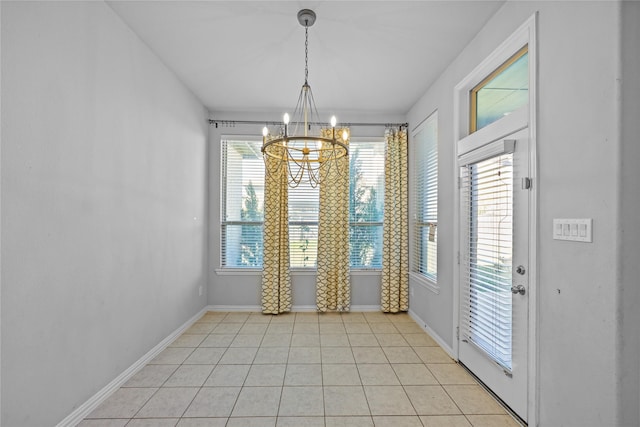 unfurnished dining area featuring light tile patterned floors and an inviting chandelier