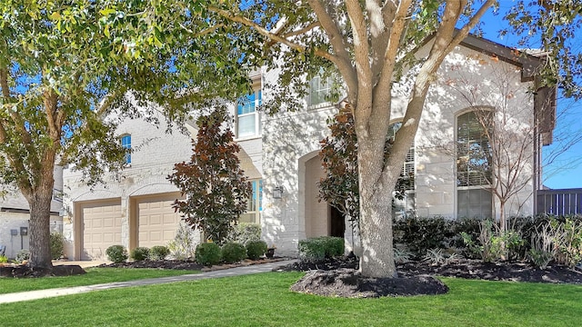 view of front facade with a front lawn and a garage