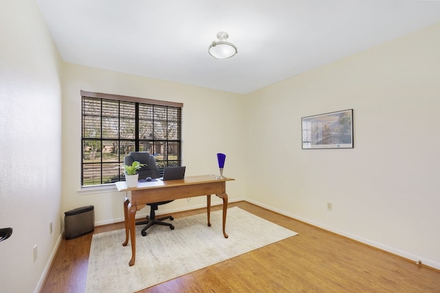 office space with hardwood / wood-style floors