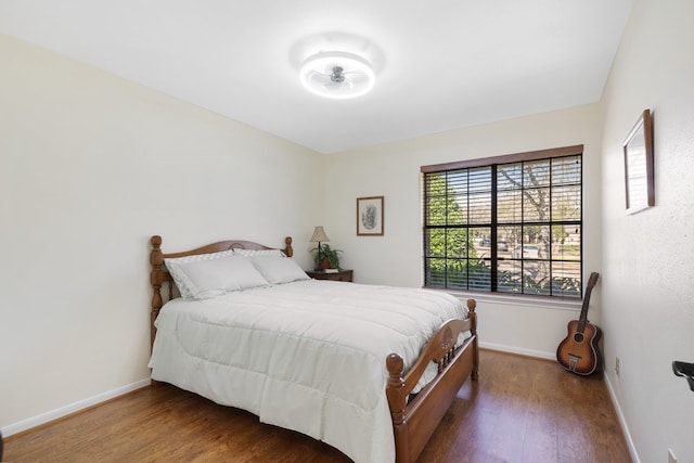 bedroom with wood-type flooring