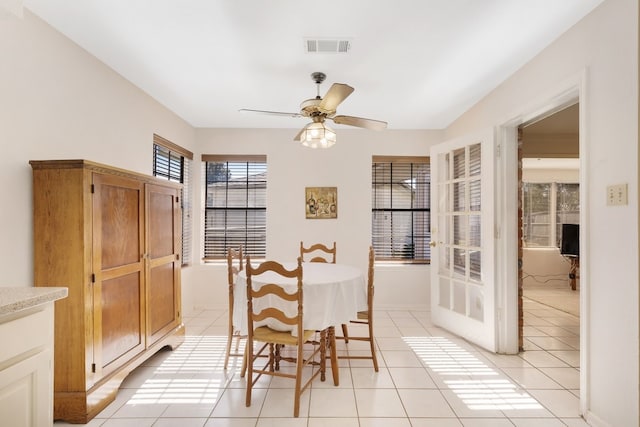 dining room with ceiling fan and light tile patterned floors