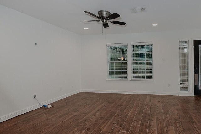 unfurnished room with dark hardwood / wood-style flooring and ceiling fan