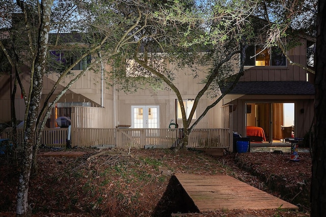 back of property featuring french doors