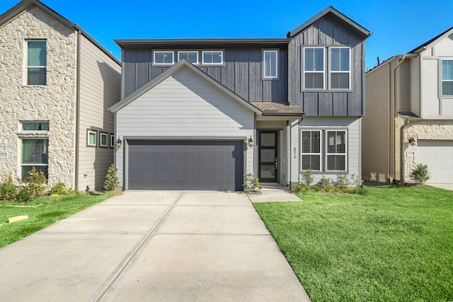 view of front facade with a front lawn and a garage