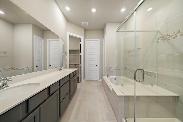 bathroom featuring vanity and plus walk in shower