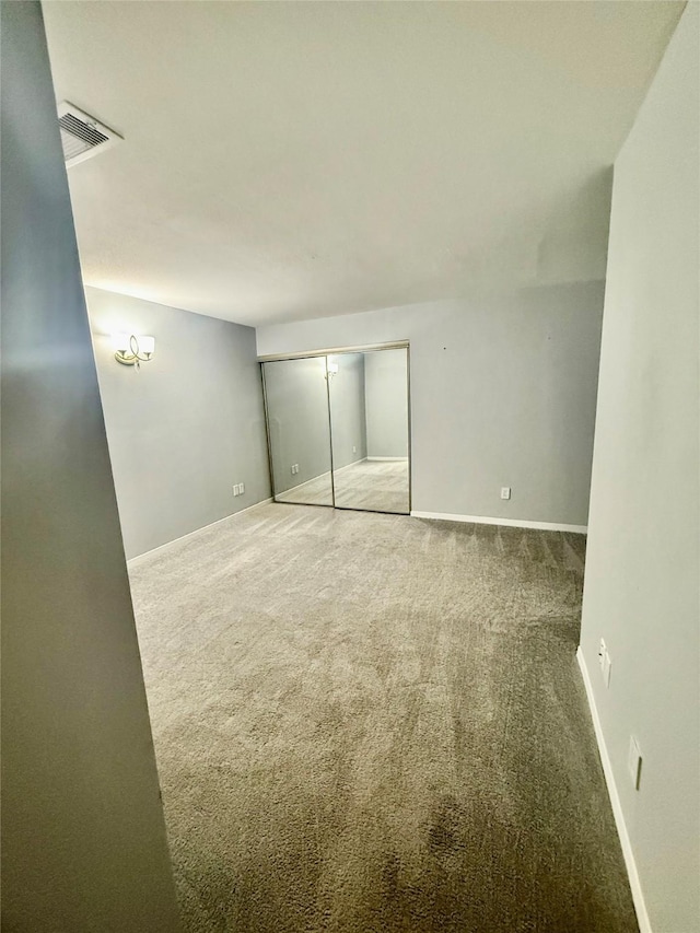 unfurnished room featuring carpet floors