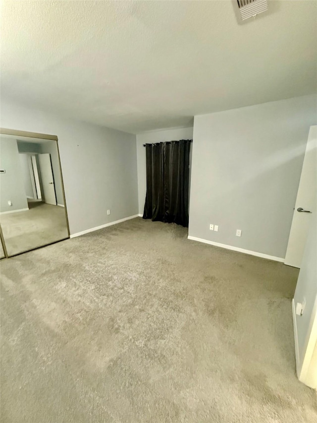 spare room with carpet flooring