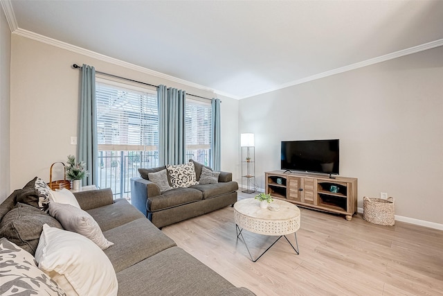 living room featuring light hardwood / wood-style flooring and ornamental molding