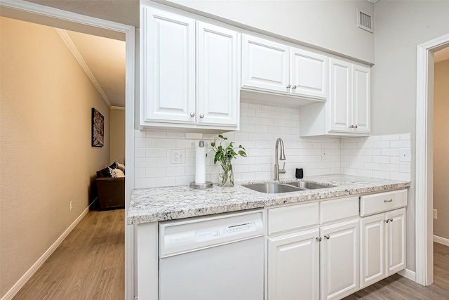 kitchen featuring white cabinetry, sink, and white dishwasher