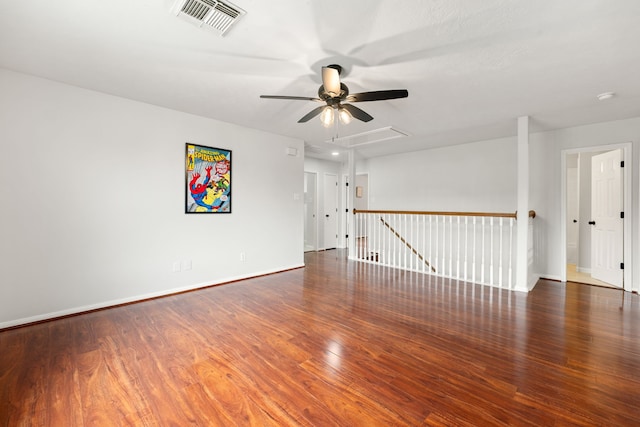 unfurnished room with dark hardwood / wood-style flooring