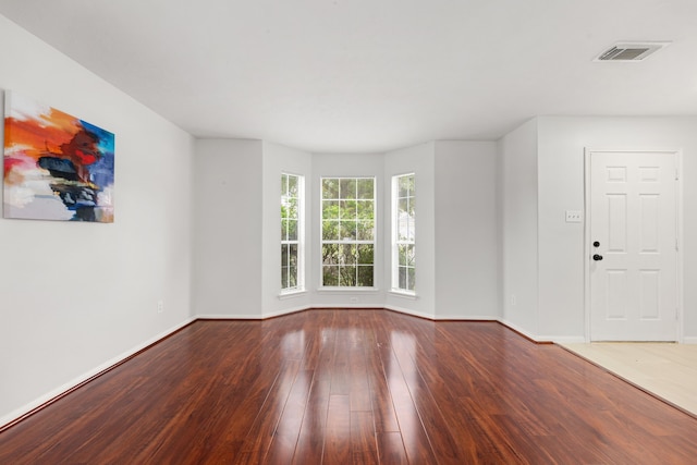 spare room featuring hardwood / wood-style flooring