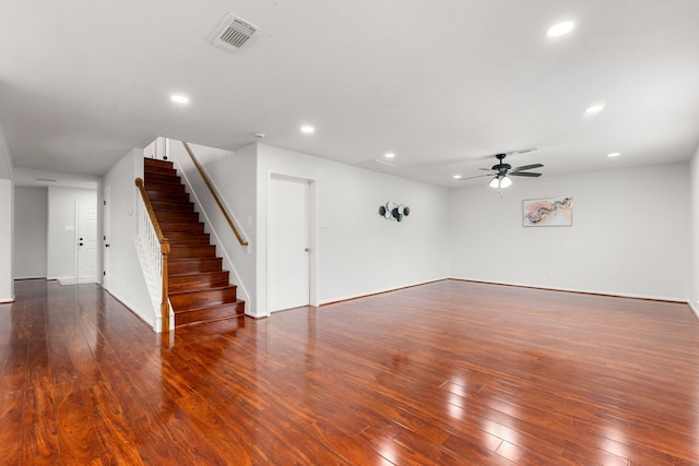 unfurnished room with ceiling fan and dark wood-type flooring