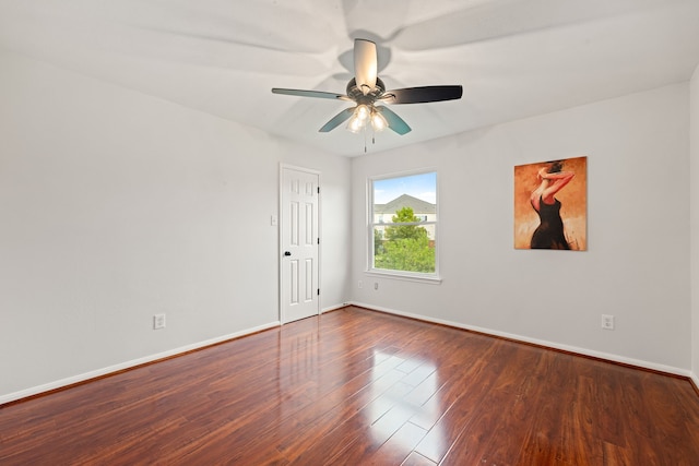 empty room featuring ceiling fan and hardwood / wood-style floors