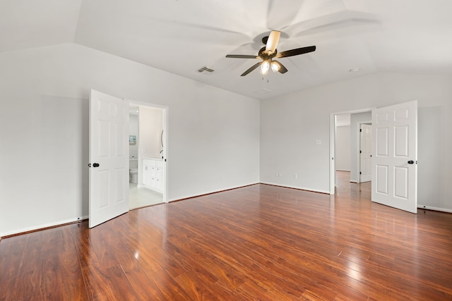 spare room with hardwood / wood-style flooring, ceiling fan, and vaulted ceiling