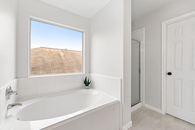 bathroom with plus walk in shower and tile patterned floors