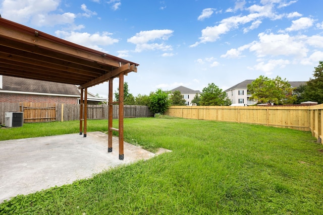 view of yard with a patio and central AC unit