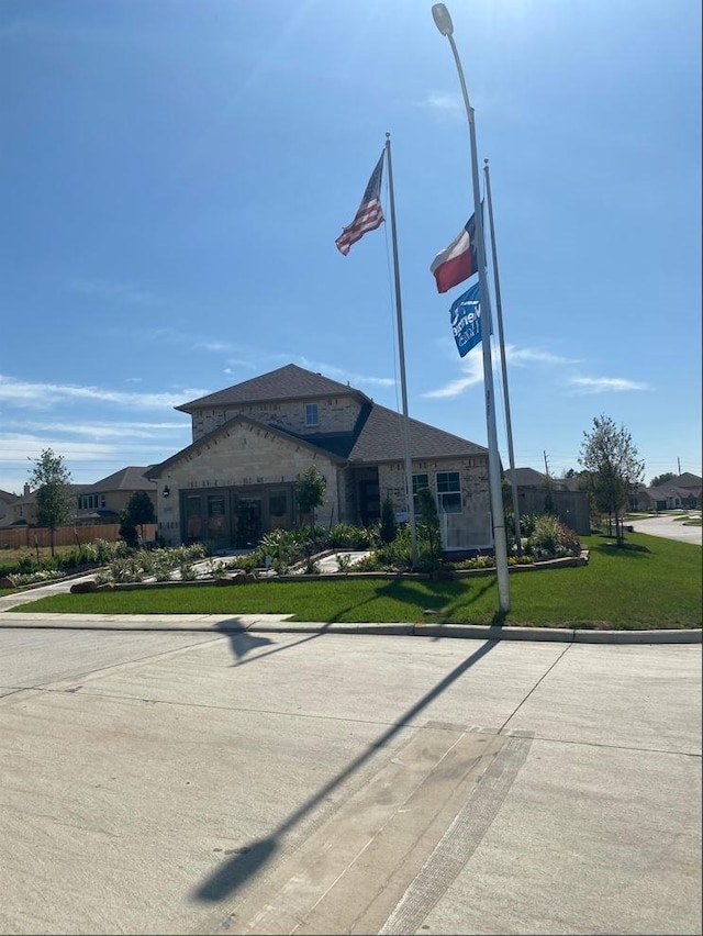 view of front of home with a front lawn