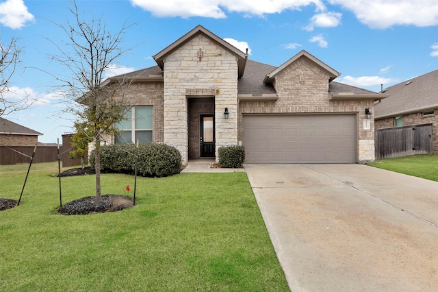 view of front of home featuring a front yard and a garage