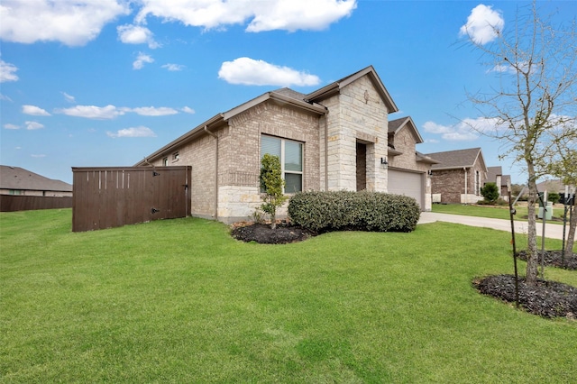 view of side of property featuring a lawn and a garage