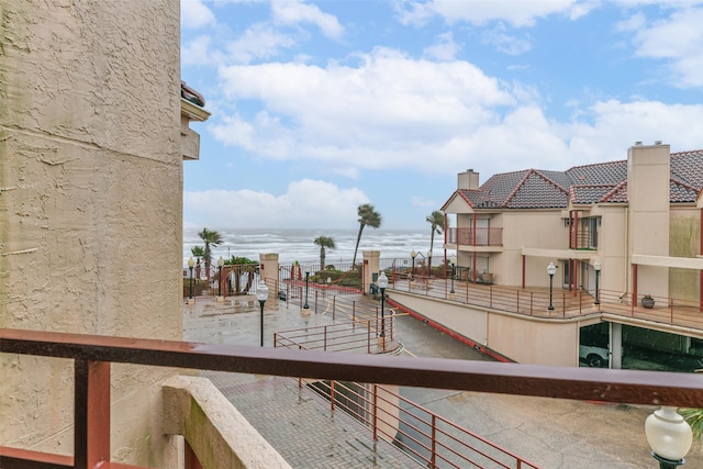 view of swimming pool featuring a water view