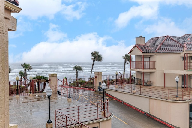 view of patio with a water view