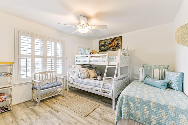 bedroom with ceiling fan and wood-type flooring