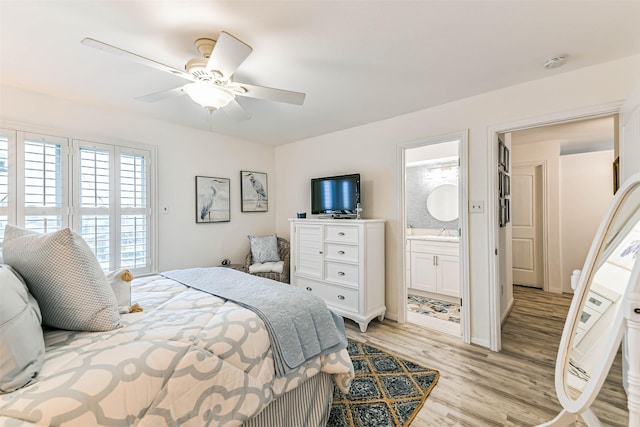 bedroom featuring ensuite bath, ceiling fan, and light hardwood / wood-style floors