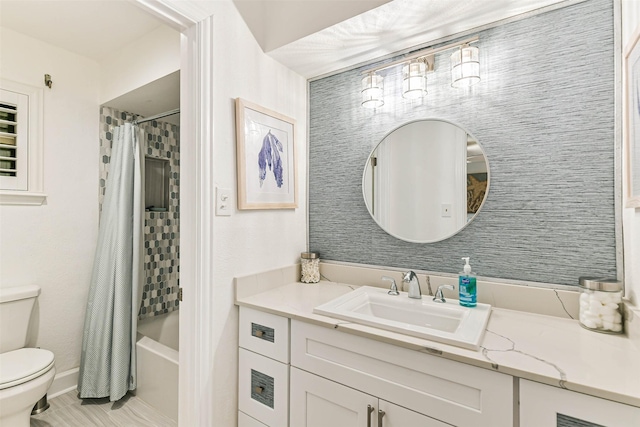 full bathroom with toilet, vanity, and shower / bath combination with curtain