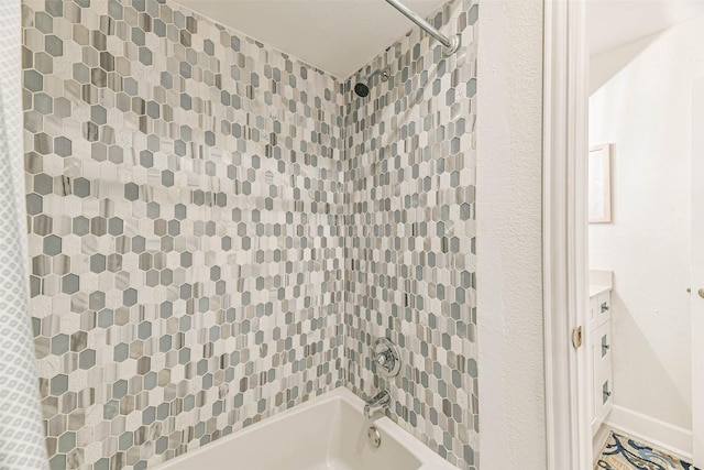 bathroom featuring vanity and bathing tub / shower combination