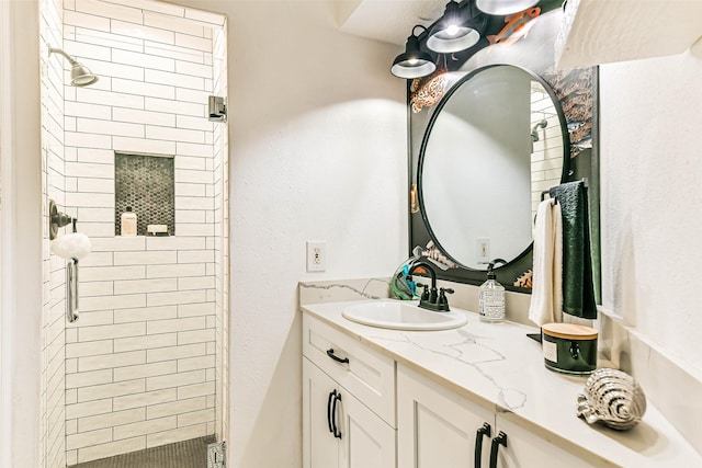 bathroom featuring an enclosed shower and vanity