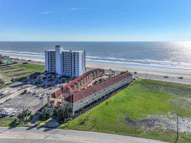 aerial view with a view of the beach and a water view