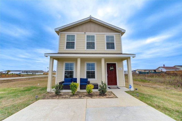 view of front facade featuring an outdoor hangout area, a porch, and a front yard