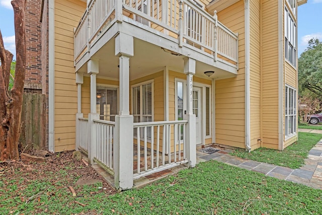 view of side of property featuring a balcony