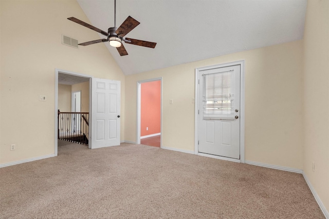 unfurnished room featuring ceiling fan, carpet floors, and high vaulted ceiling