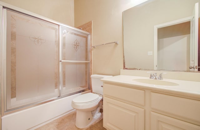 full bathroom with tile patterned flooring, vanity, toilet, and enclosed tub / shower combo