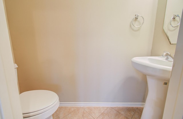 bathroom featuring tile patterned flooring and toilet