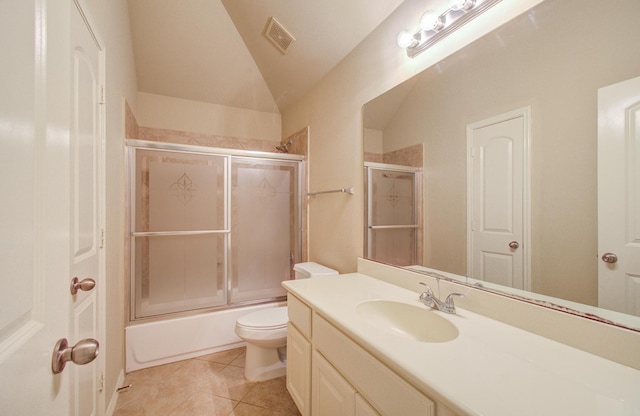 full bathroom with combined bath / shower with glass door, tile patterned floors, vaulted ceiling, toilet, and vanity