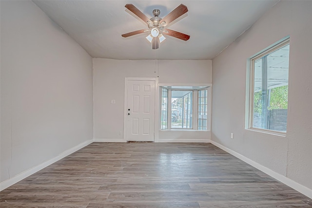 spare room featuring ceiling fan and hardwood / wood-style floors