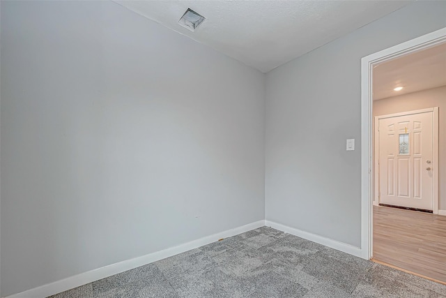 spare room featuring carpet floors