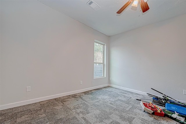 spare room featuring carpet flooring and ceiling fan