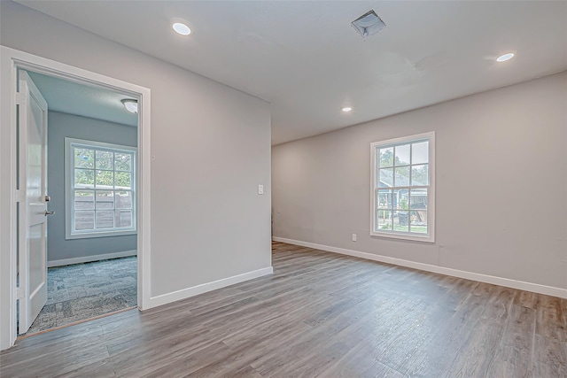 unfurnished room with light hardwood / wood-style floors