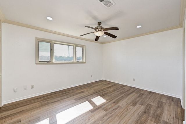 empty room featuring ornamental molding, dark hardwood / wood-style floors, and ceiling fan