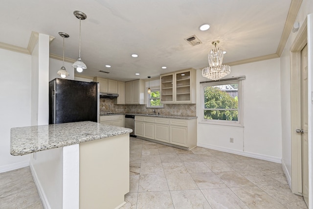 kitchen with decorative light fixtures, sink, backsplash, light stone counters, and black appliances