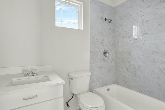 full bathroom featuring vanity, toilet, and tiled shower / bath