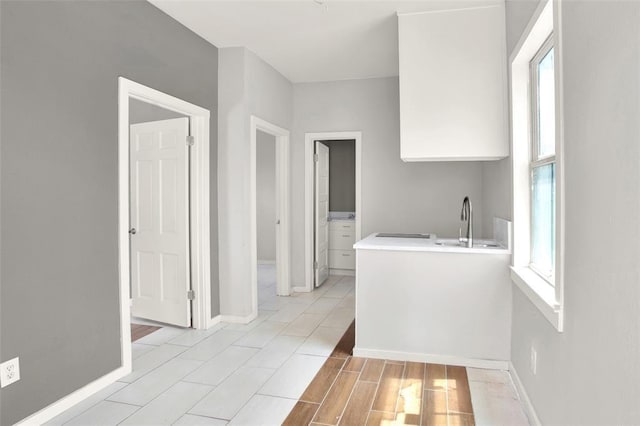 bathroom featuring plenty of natural light and sink