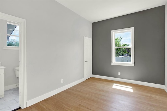 spare room featuring light hardwood / wood-style floors