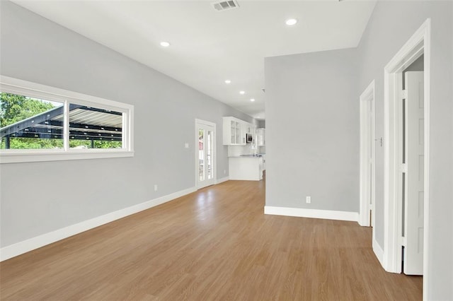 unfurnished living room featuring light wood-type flooring