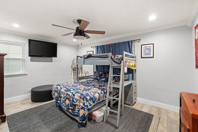 bedroom with crown molding, ceiling fan, and light wood-type flooring