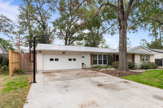 single story home featuring a garage